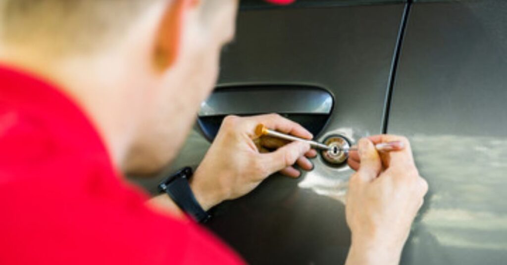 Our Car locksmith repairing a car lock